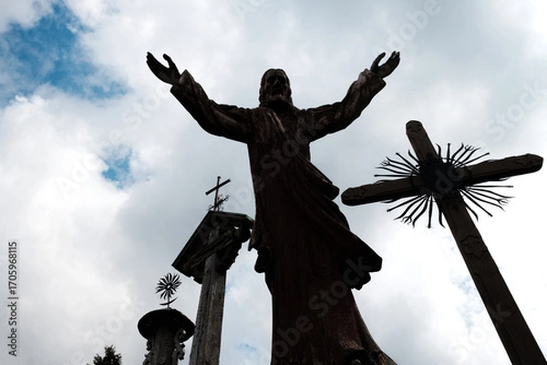 Fototapeta View of silhouettes on holy hill of crosses, place of pilgrimage and worship of Christians around world
