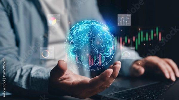 Fototapeta Businessman using laptop analyzing global stock market data and economic growth graph chart. Business strategy and planning. Digital marketing. Financial and banking. Investment. Technology. Metaverse