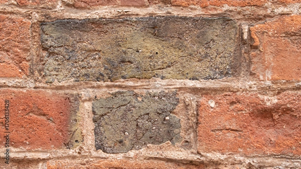 Fototapeta Detail of an old wall made of brown rectangular bricks
