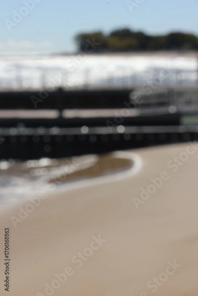 Fototapeta A blurry background view of the pier and sea