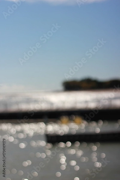 Fototapeta A blurry background view of the pier and sea