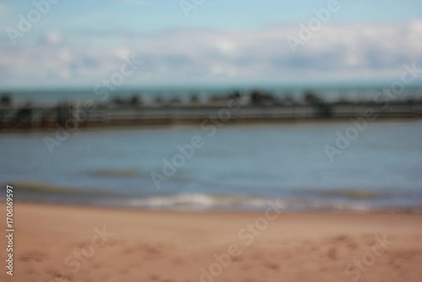 Fototapeta A blurry background view of the pier and sea