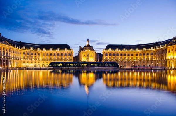 Fototapeta Reflection at blue hour of the Bourse Place with tramway in Bordeaux