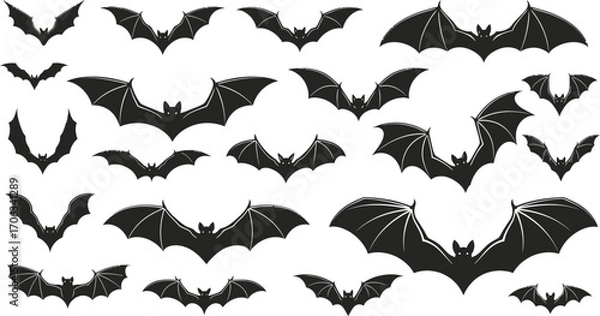 Fototapeta Silhouetted bats in various flying positions on a white background for halloween