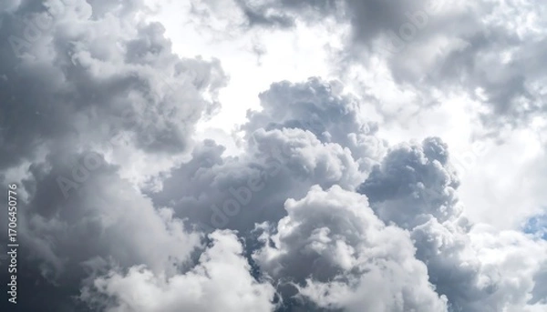 Fototapeta Dense, varied clouds filling the sky