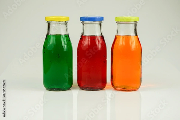 Fototapeta Fruit and vegetable juice bottles isolated on white background