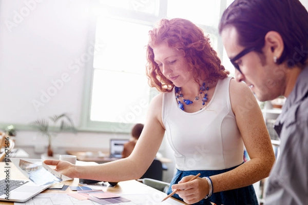 Fototapeta Two young architects in office