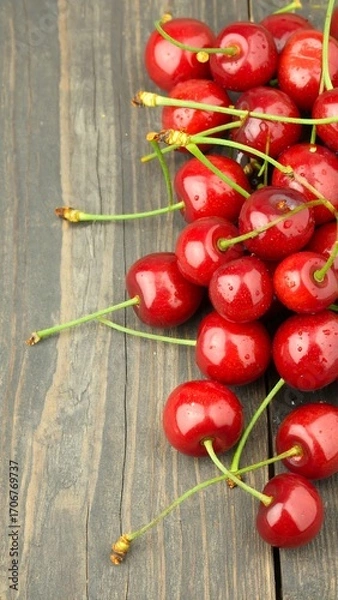 Obraz Freshly picked cherries on a rustic wooden surface