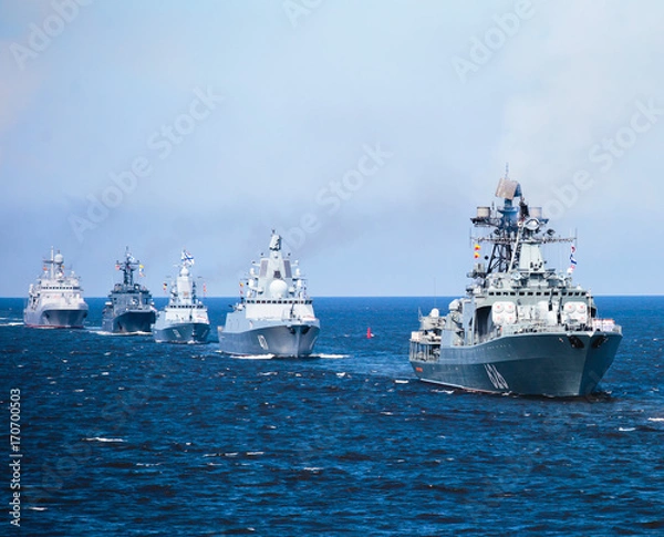 Fototapeta A line of modern russian military naval battleships warships in the row, northern fleet and baltic sea fleet in the open sea