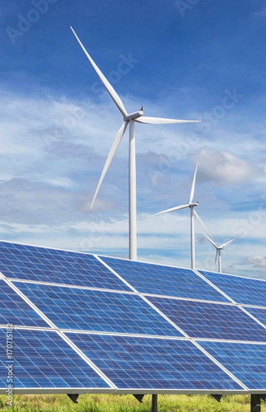 Obraz solar panels and wind turbines generating electricity in power station green energy renewable with blue sky background 