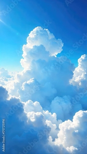 Fototapeta Vast expanse of fluffy white cumulus clouds drifting across a brilliant azure sky, a breathtaking summer day scene , cloud formations, bright, white