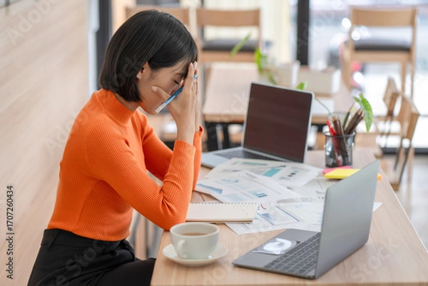 Fototapeta Woking woman with stressed and worried about working mistake and problems