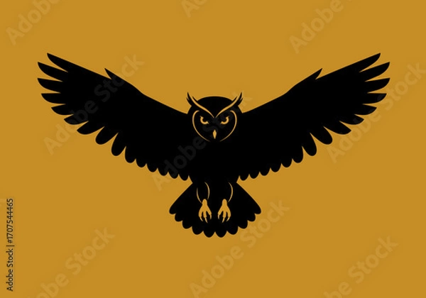 Fototapeta Black owl with open wings centered on a solid goldenrod backdrop