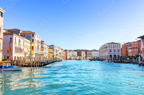 Fototapeta Beautiful view of the Grand Canal with palaces, gondolas and boats in sunny day in Venice, Italy.