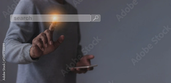 Fototapeta Young man with smartphone mobile hand touching search bar, Search job