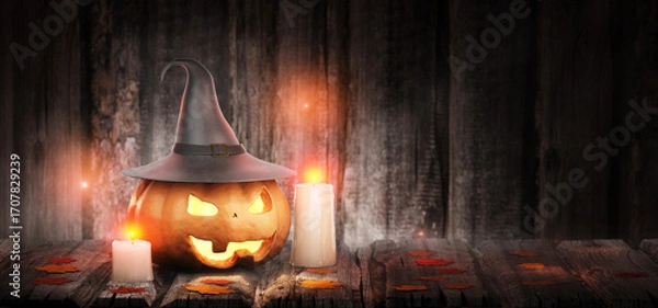 Fototapeta Holiday banner. Halloween lantern with yellow autumn leaves. Halloween concept. Pumpkin with a carved scary face in the smoke. Jack-o'-lantern. 3D rendering.
