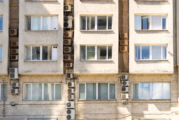 Fototapeta Air conditioners on the facade of the house, ventilation and cooling system, air purification technology. split system.
