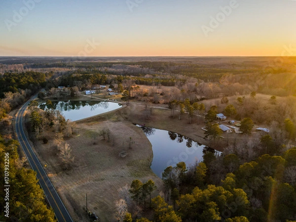 Obraz Aerial landscape rural forest winter sunset after Hurricane Helene in Newton County Georgia