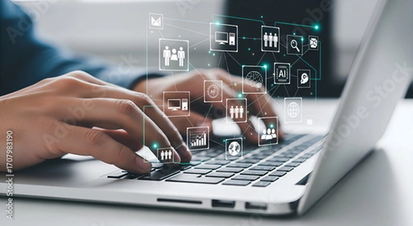 Fototapeta A person is working at a laptop with virtual icons symbolizing technology. The image is suitable for business, innovation, and digital transformation concepts.