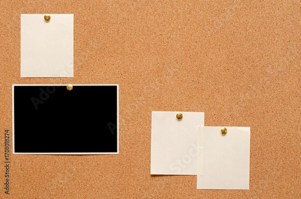 Fototapeta Blank paper notes and an empty photo are pinned to a cork board. The concept of detective investigation or a webinar.