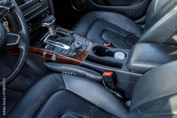 Fototapeta Modern Vehicle Cockpit with Car Keys in Ignition, Steering Wheel and Multimedia Display on Dashboard