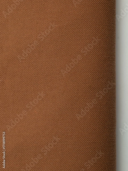 Obraz Dark dense fabric for sewing clothes, ironed, the texture of the fabric is visible