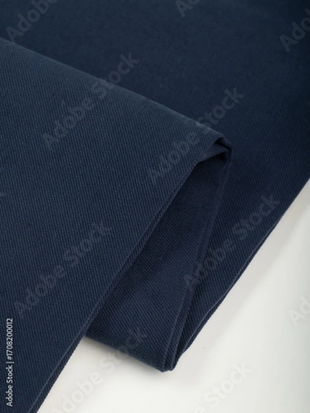 Obraz Dark dense fabric for sewing clothes, ironed, the texture of the fabric is visible