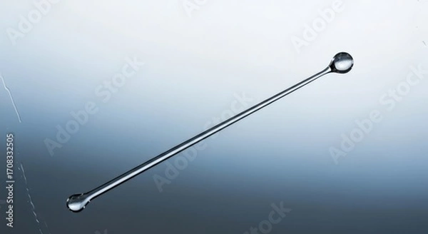 Obraz Water Droplet on a Thin Glass Rod Captured to Showcase Fluid Dynamics and Minimalist Aesthetics