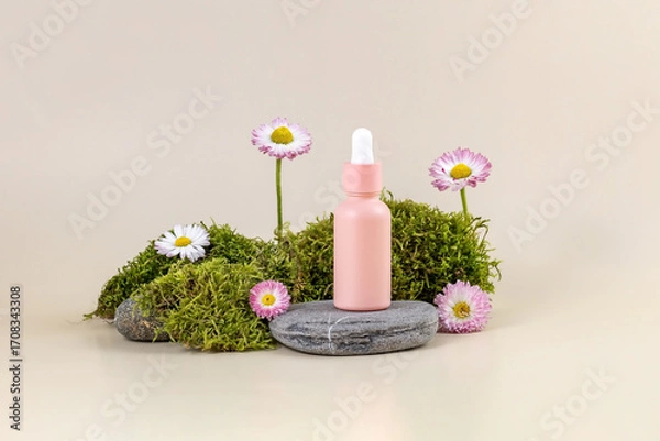 Fototapeta bottle of essential oil with a pipette and daisy flowers on a stone podium next to moss on a beige background. The concept of skin care using natural cosmetics