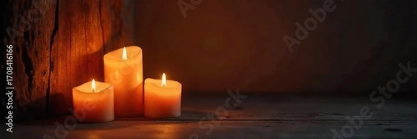 Fototapeta Warm, flickering candlelight illuminates a dark room, casting enchanting shadows on the walls Perfect for ambiance, relaxation, and romantic themes Cozy and inviting atmosphere , night, mood, shadows