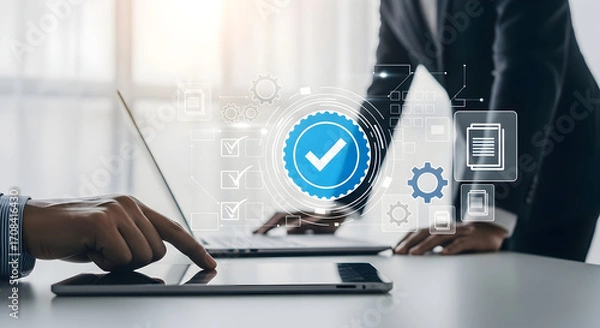 Obraz Business professionals collaborating on digital tablet with security checkmark and technology icons in modern office setting for corporate teamwork and data protection