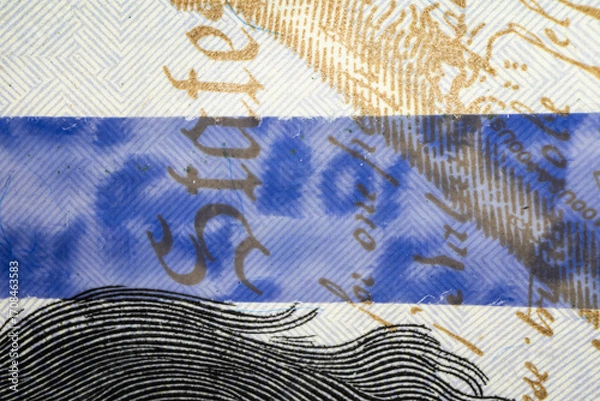 Fototapeta Macro Shot of 100 Dollar Bill Security Ribbon