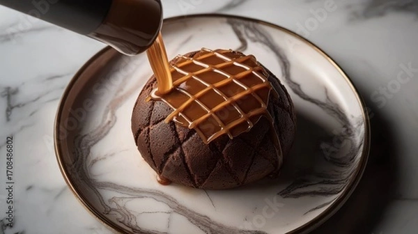 Fototapeta Professional caramel sauce drizzle technique creating perfect lattice pattern on artisan chocolate dessert with elegant fine dining presentation