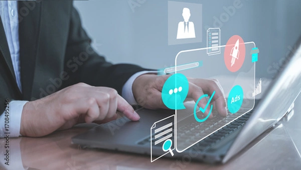 Fototapeta Businessman using laptop with digital interface icons, online communication, business analytics, and technology innovation concept.