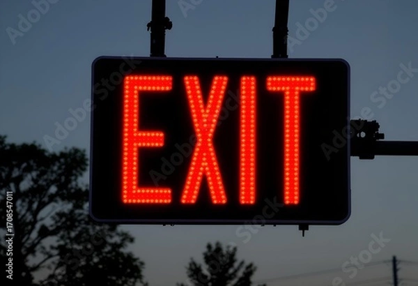 Fototapeta Illuminated Red Exit Sign at Dusk