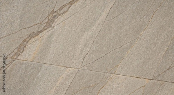 Fototapeta Close-up view of a light gray stone or tile surface with golden veins