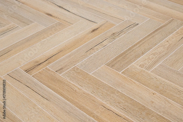 Fototapeta Wood like floor tiles arranged in herringbone pattern