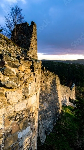 Obraz Ancient stone wall and tower at sunset