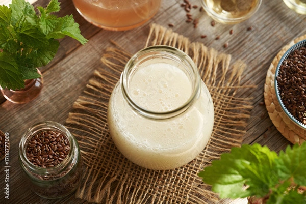 Fototapeta DIY shampoo made of homemade flax seed gel, argan oil, apple cider vinegar, nettle and coco glucoside