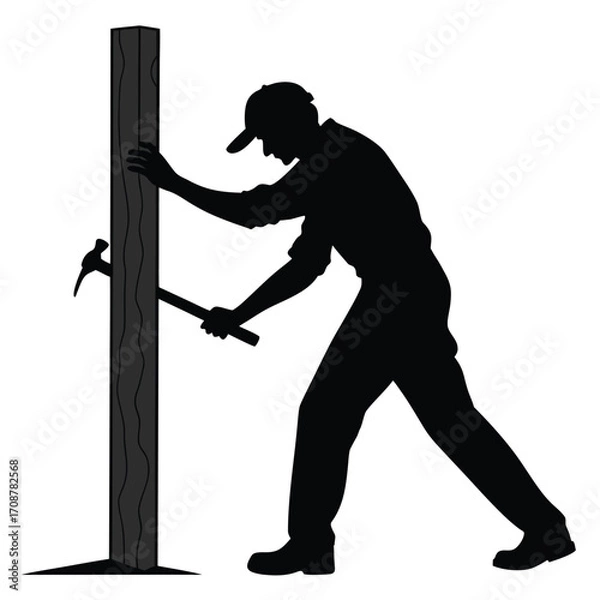 Obraz Man hammering wooden post