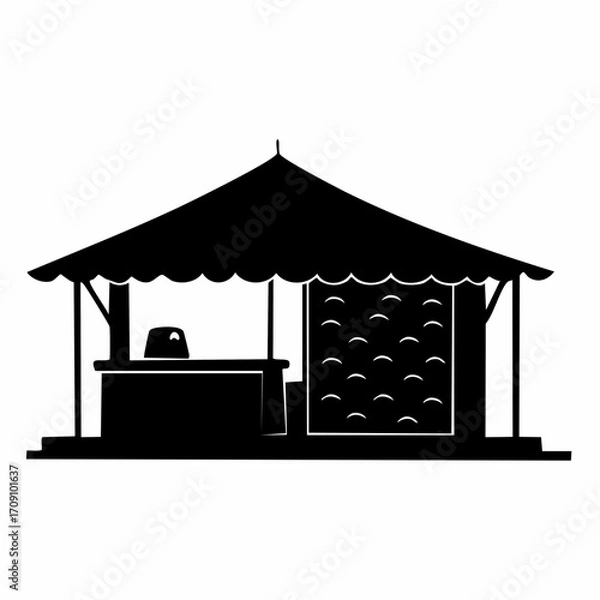 Fototapeta Silhouette of an open-air market stall with a counter and a decorative backdrop, suggesting a place for commerce or display.