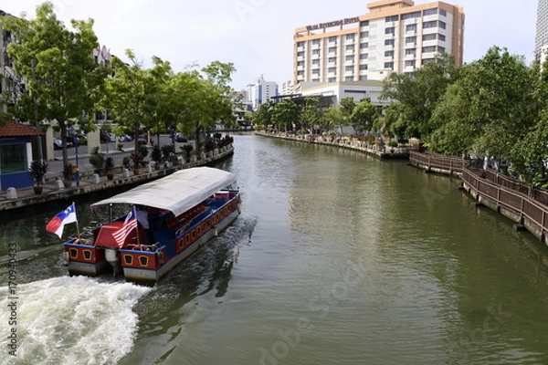 Fototapeta A tourist boat in Malacca River, Malacca city, Melaka, Malaysia