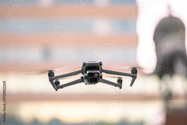 Fototapeta Professional drone with camera is hovering