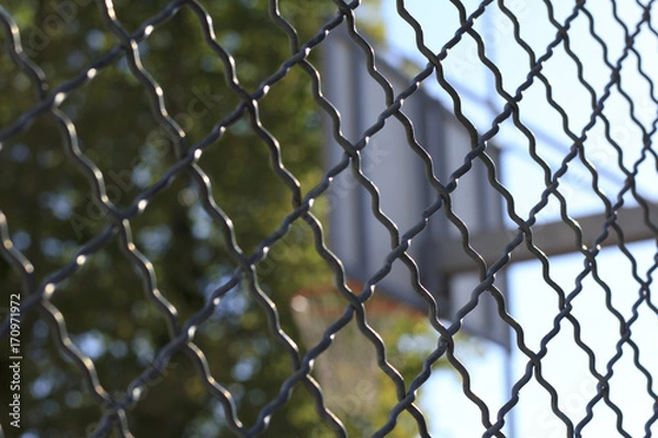Obraz Fence in front of basketball hoop
