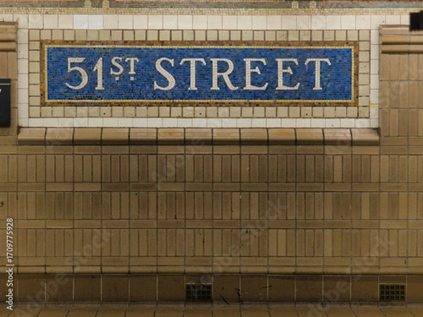 Fototapeta 51st Street Subway Station Sign - A detailed shot of the tiled mosaic sign for the 51st Street subway station in New York City, a classic example of urban transportation design.