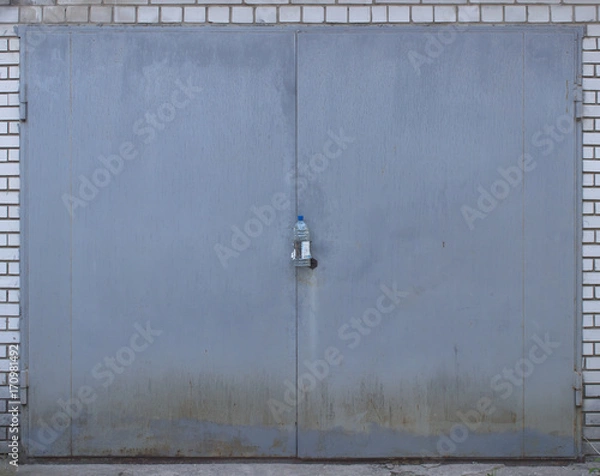 Fototapeta Metallic gate painted in gray