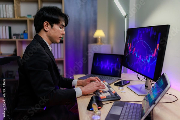 Fototapeta Trader analyzing online stock charts with concern as the market falls.