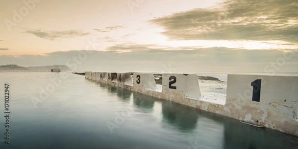 Fototapeta Merewether Baths starting blocks at sunrise