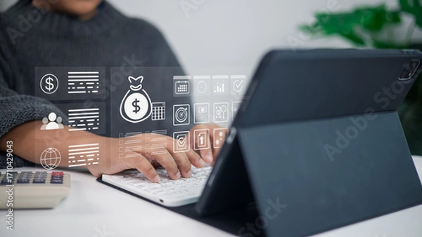 Fototapeta Businessman using tablet with digital finance and fintech icons for online banking and investment technology