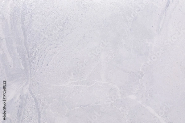 Fototapeta Light gray concrete surface with subtle texture and natural patterns for construction or design projects